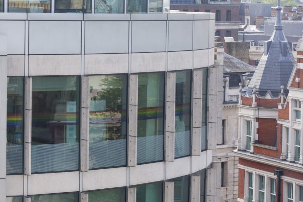 Rainbow stickers on the windows, viewed from outside