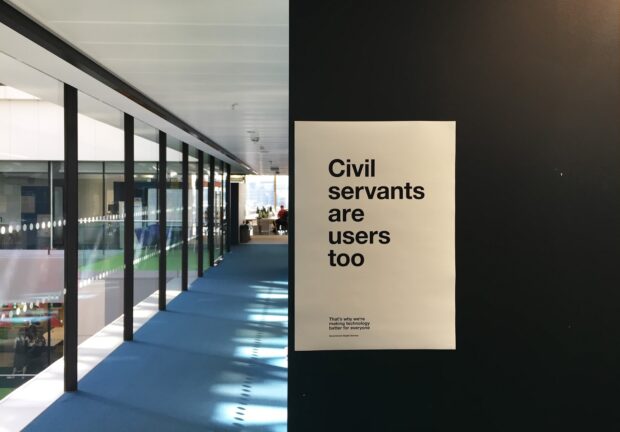 A poster on a wall in the GDS office saying ‘Civil servants are users too’.