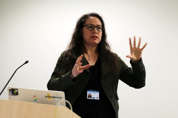 Nikola Goger, design lead at the Ministry of Justice, standing behind a lectern while speaking at a cross-government design meetup in London in early 2020