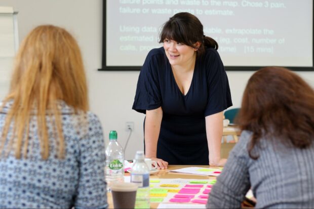 Design trainer Clara Greo in conversation with people attending training